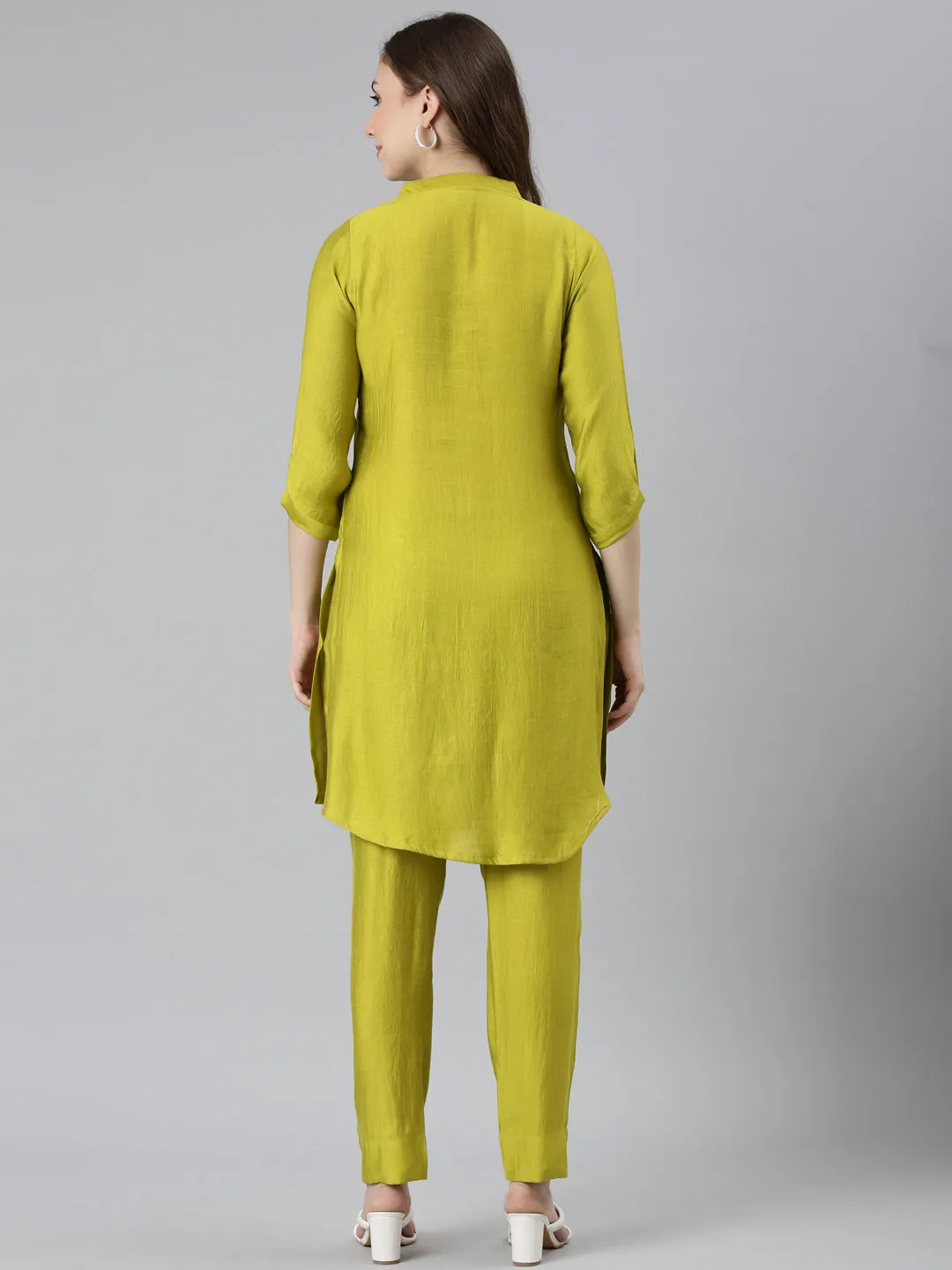 Neerus Green Regular Curved Solid Kurti and Trousers